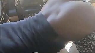 Black Slut Keeps Dick in her Mouth While Shaking Her Ass In Car